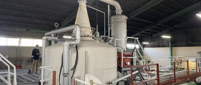 A stainless steel pot still, painted off-white, in Chiran Jozo, a shochu distillery in Southern Kagoshima Prefecture.